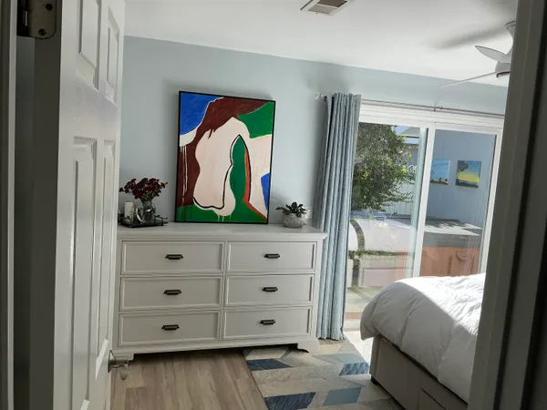 a view of bedroom with a bed and a dresser