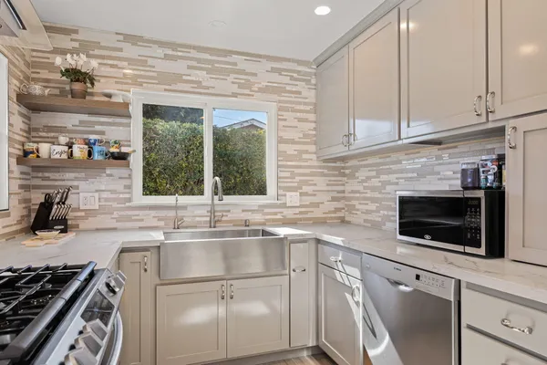 a kitchen with a sink and cabinets