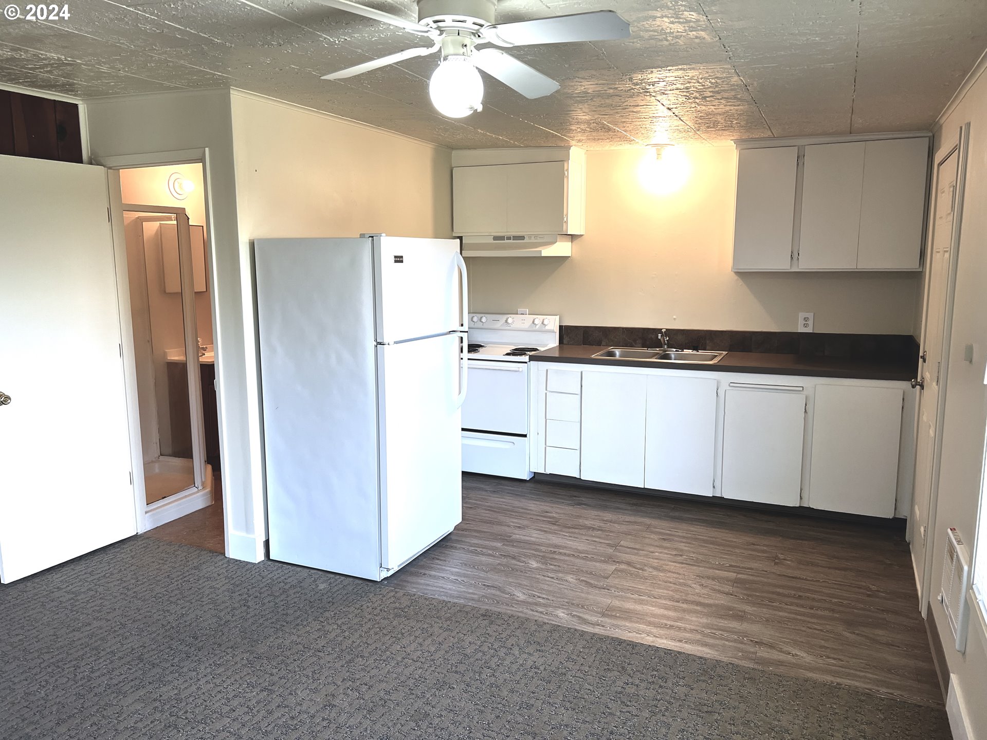 30021 Southeast Orient Drive Gresham, OR 97080 - Photo 19 of 27 a kitchen with stainless steel appliances a refrigerator sink and cabinets