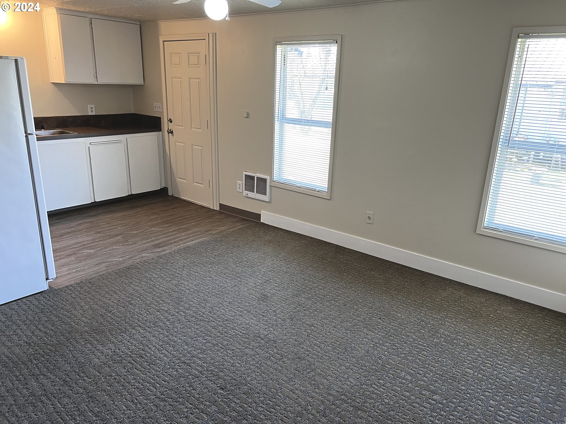 30021 Southeast Orient Drive Gresham, OR 97080 - Photo 23 of 27 a view of a kitchen with wooden floor and electronic appliances