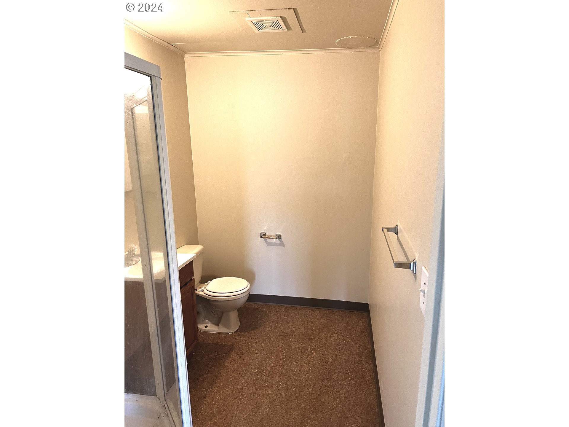 30021 Southeast Orient Drive Gresham, OR 97080 - Photo 25 of 27 a bathroom with a granite countertop toilet and a sink