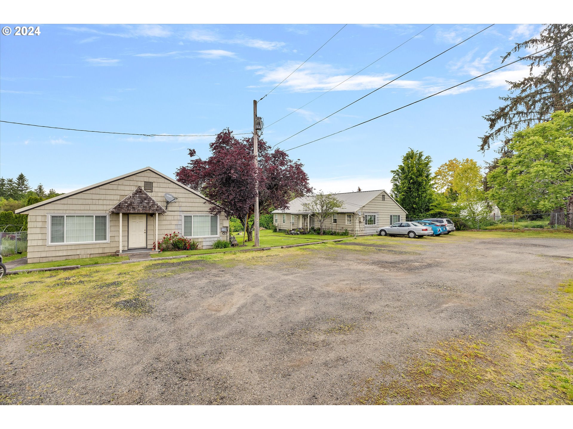 30021 Southeast Orient Drive Gresham, OR 97080 - Photo 5 of 27 a view of a big house with a big yard and large trees