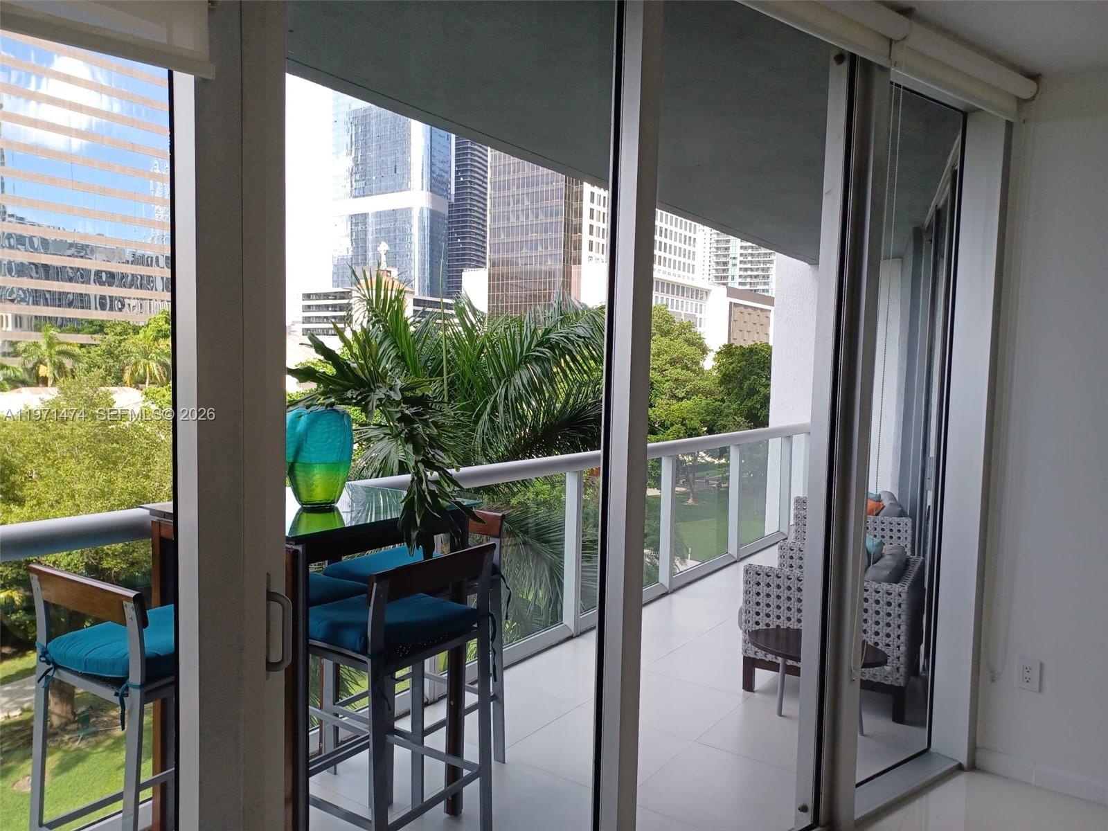 495 Brickell Avenue, Unit 509 Miami, FL 33131 - Photo 14 of 25 a room view with a floor to ceiling window and wooden floor