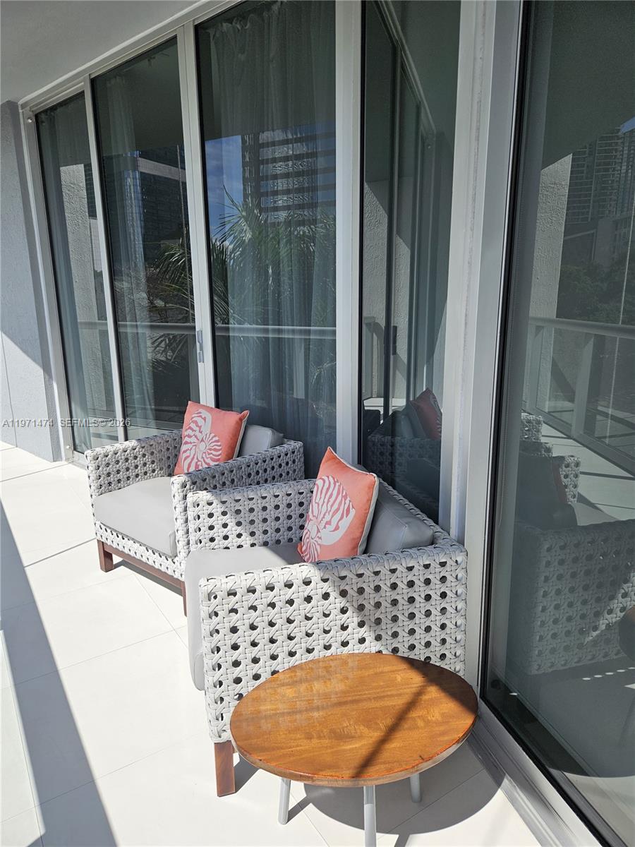 495 Brickell Avenue, Unit 509 Miami, FL 33131 - Photo 19 of 25 a bedroom with a bed and a dresser