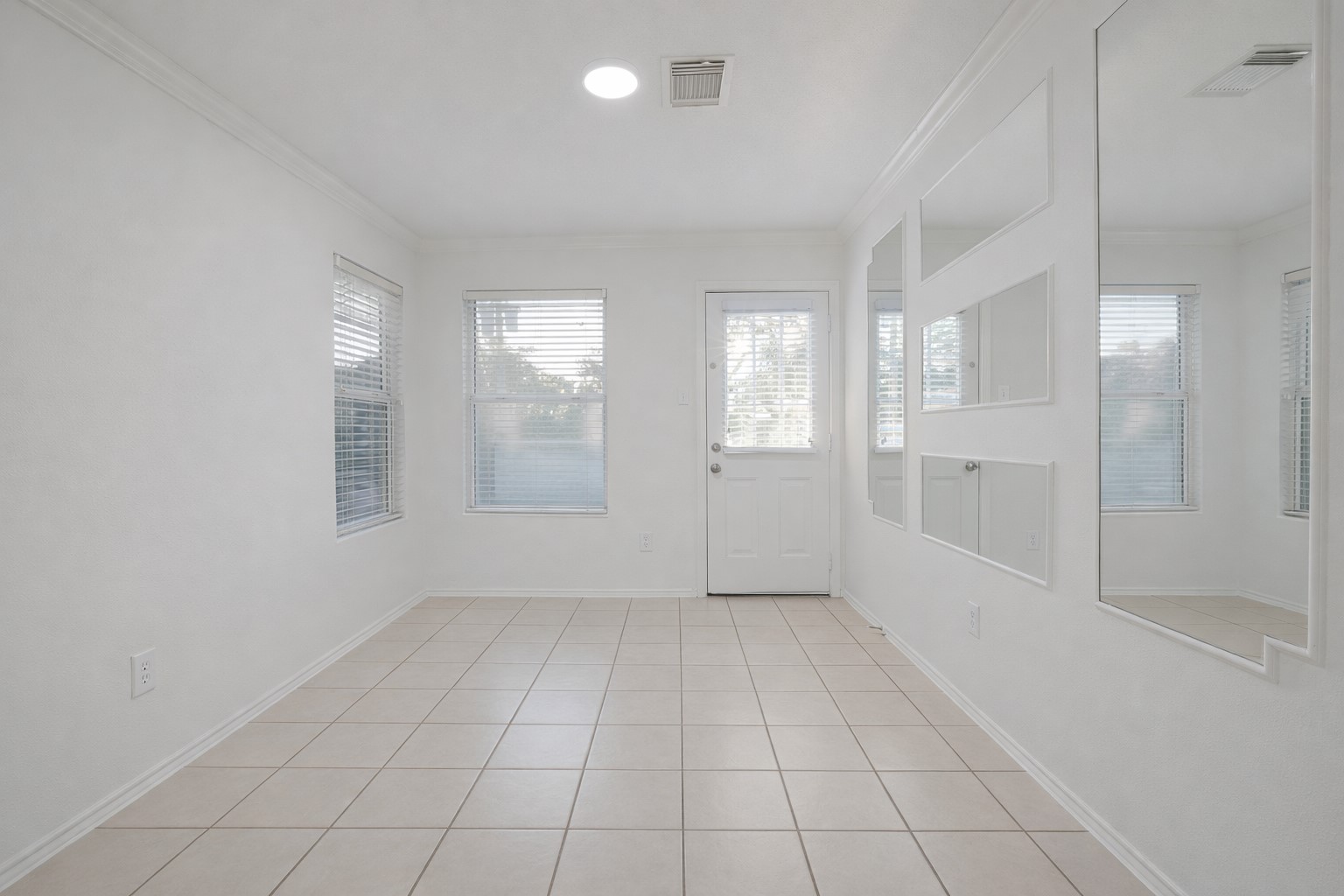 7907 Fire Thorn Lane Cypress, TX 77433 - Photo 11 of 17 a view of an empty room with window and chandelier fan