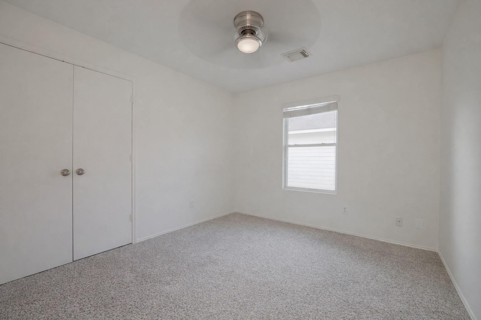 7907 Fire Thorn Lane Cypress, TX 77433 - Photo 12 of 17 an empty room with a empty space and a window
