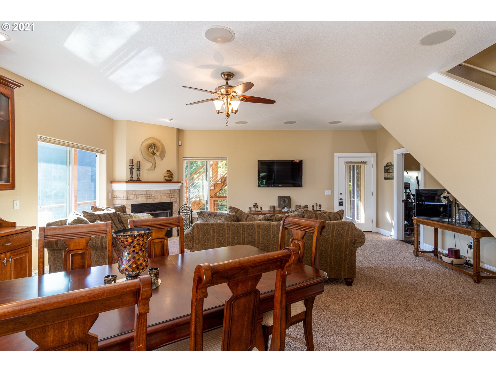 70946 Devore Arm Road Lakeside, OR 97449 - Photo 15 of 48 a view of a livingroom with furniture a flat screen tv and a chandelier