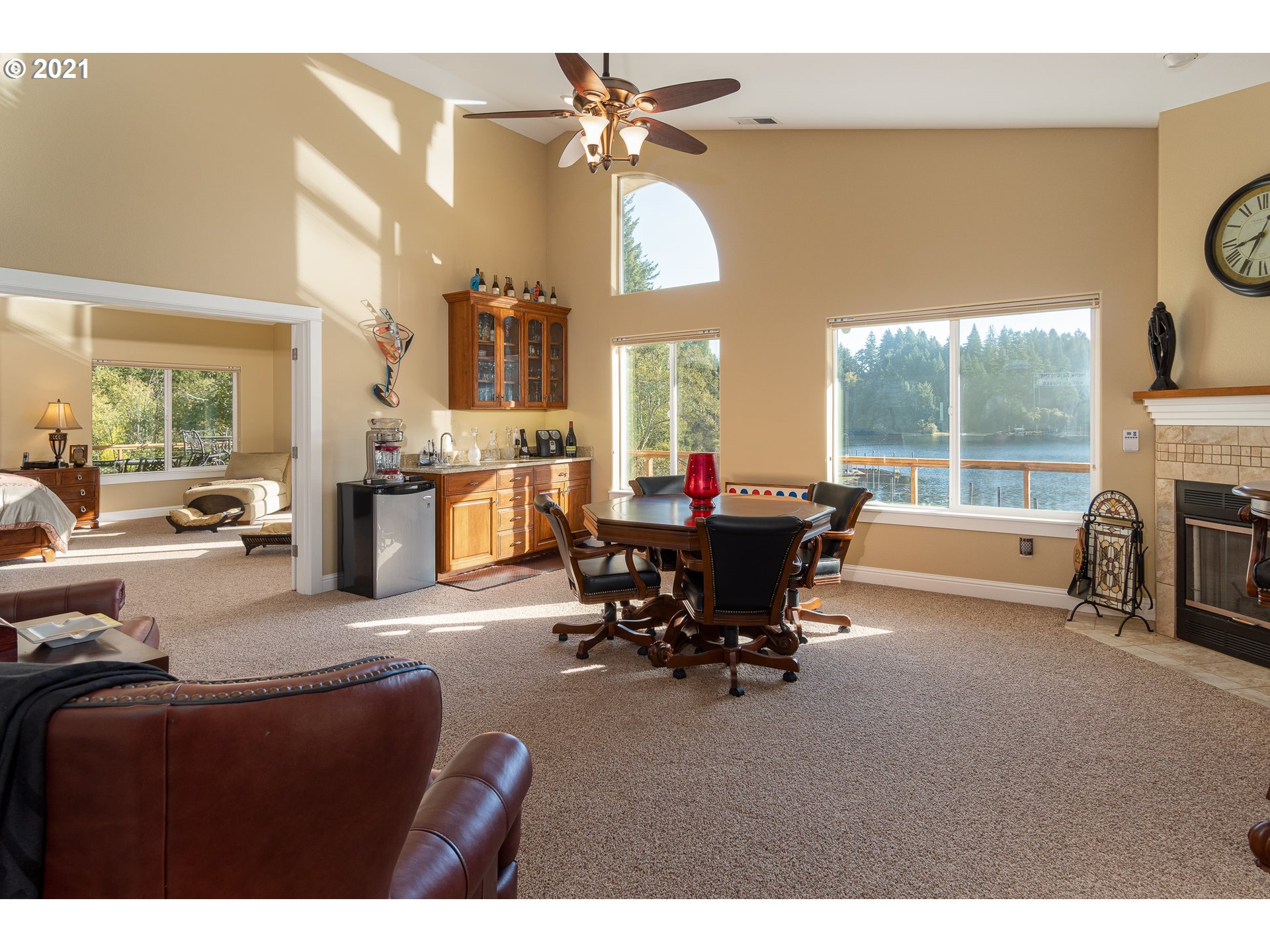 70946 Devore Arm Road Lakeside, OR 97449 - Photo 17 of 48 a living room with furniture a fireplace and a large window