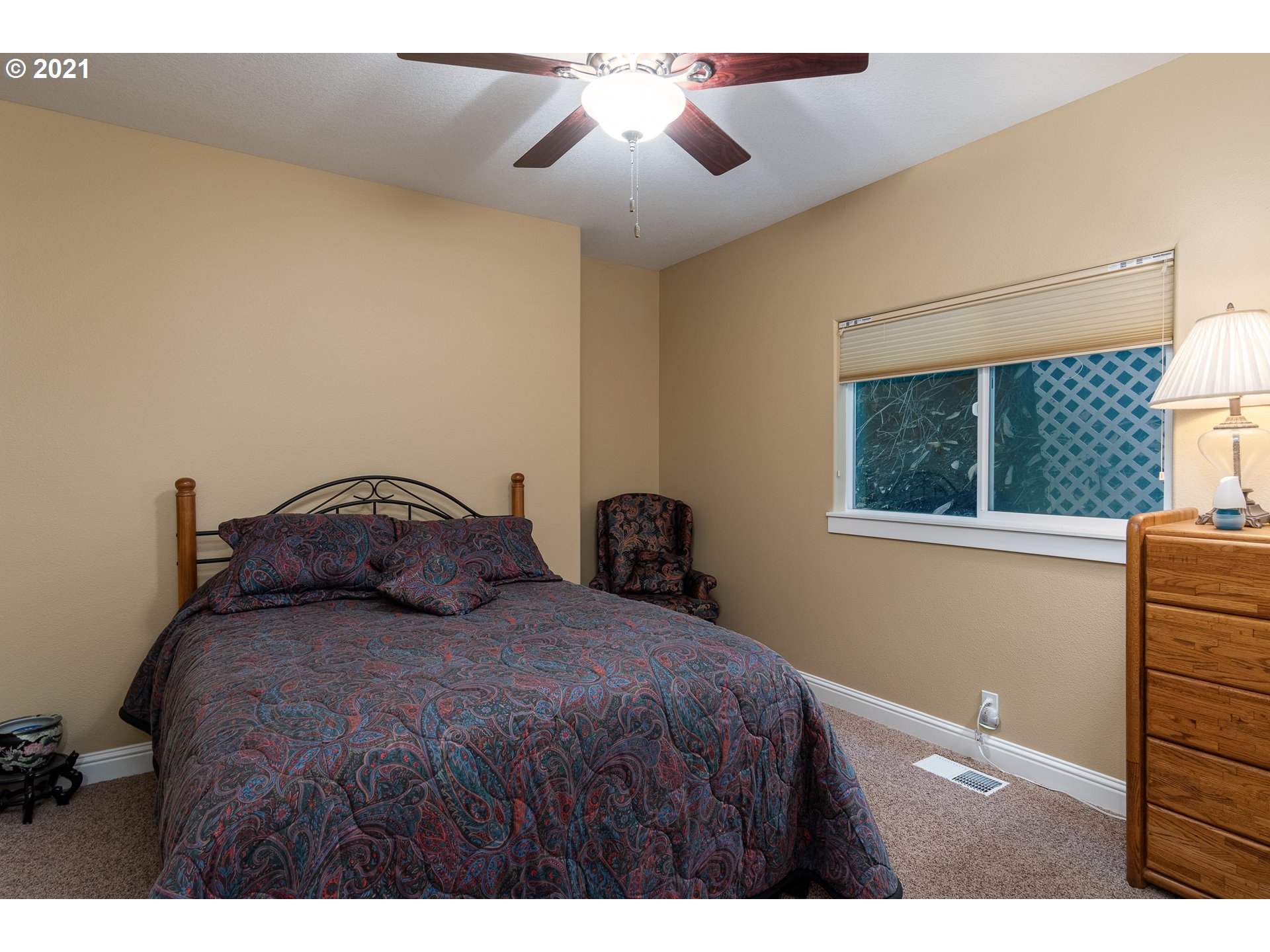 70946 Devore Arm Road Lakeside, OR 97449 - Photo 21 of 48 a bedroom with a bed and a window
