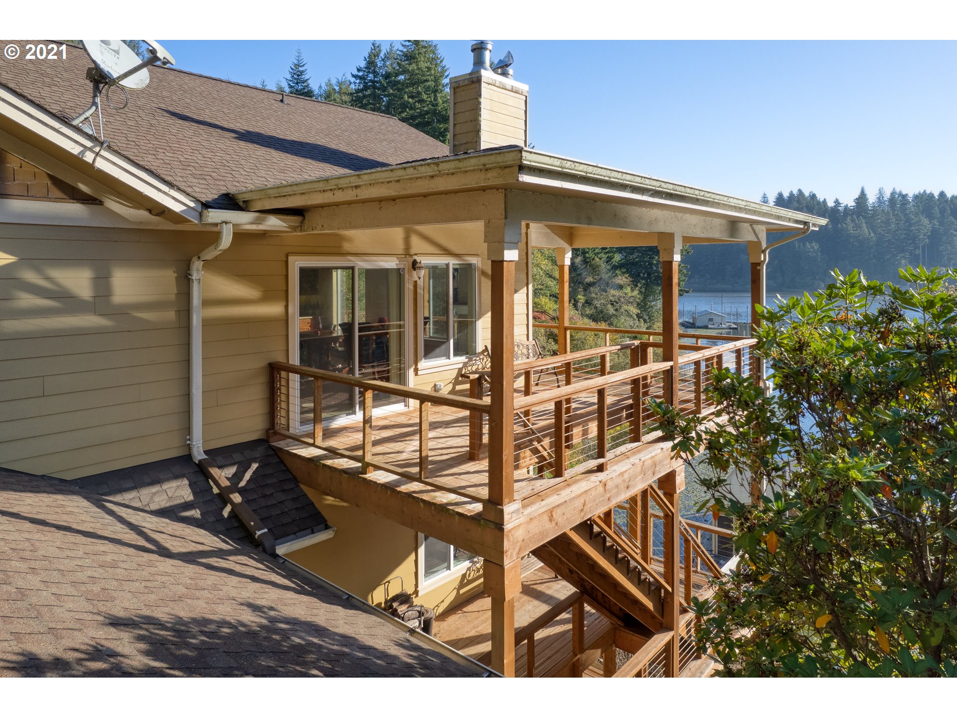 70946 Devore Arm Road Lakeside, OR 97449 - Photo 34 of 48 a view of a house with backyard and porch