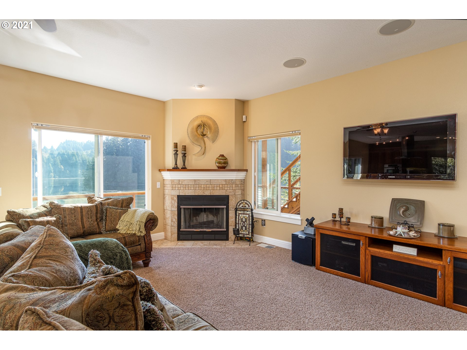 70946 Devore Arm Road Lakeside, OR 97449 - Photo 7 of 48 a living room with furniture and a flat screen tv