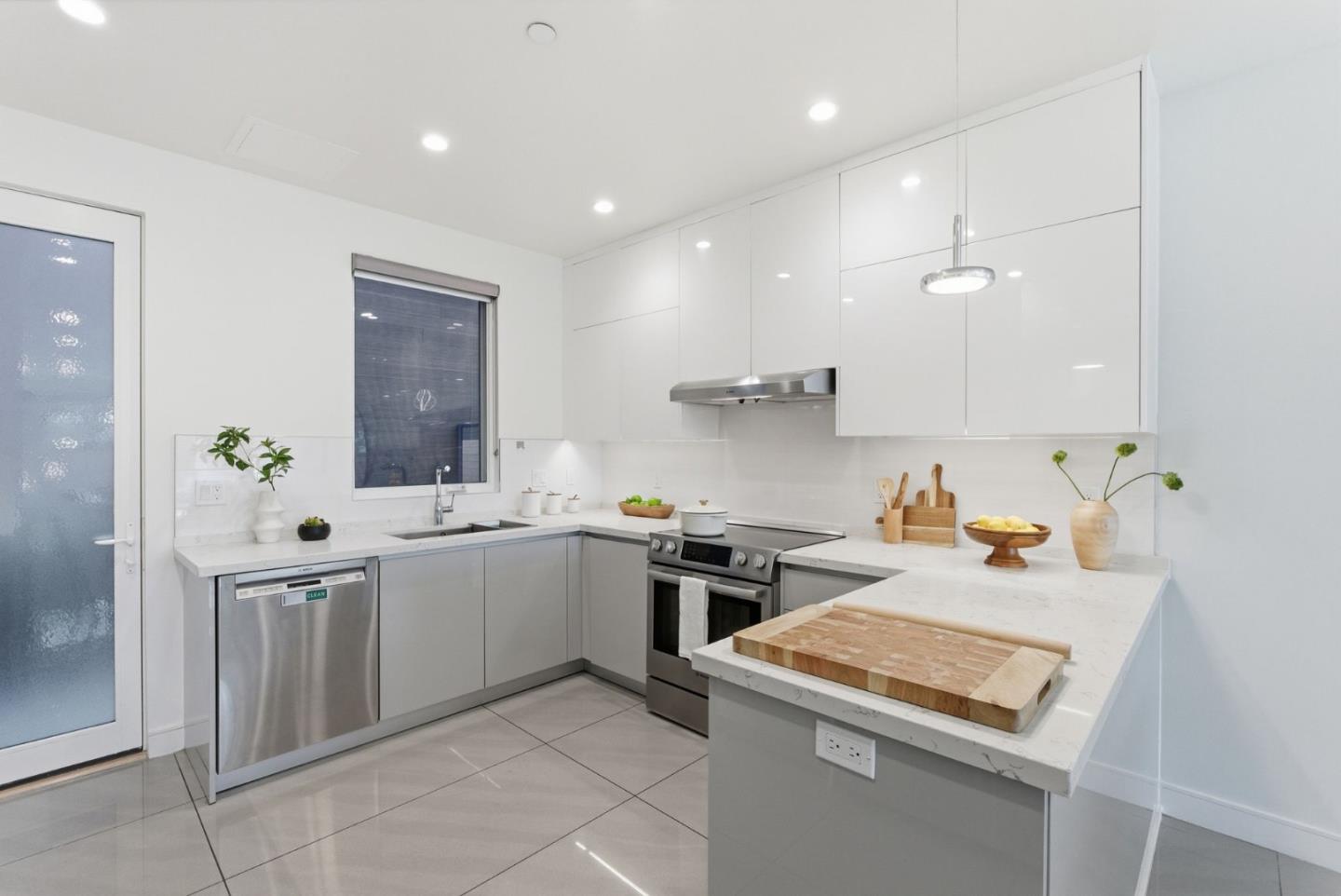 1705 Lawrence Road Santa Clara, CA 95051 - Photo 11 of 45 a kitchen with a sink stove and cabinets