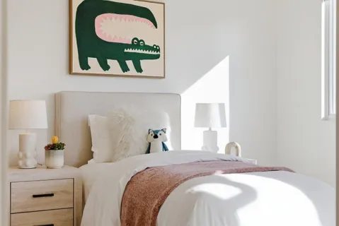 a bedroom with a bed and dresser