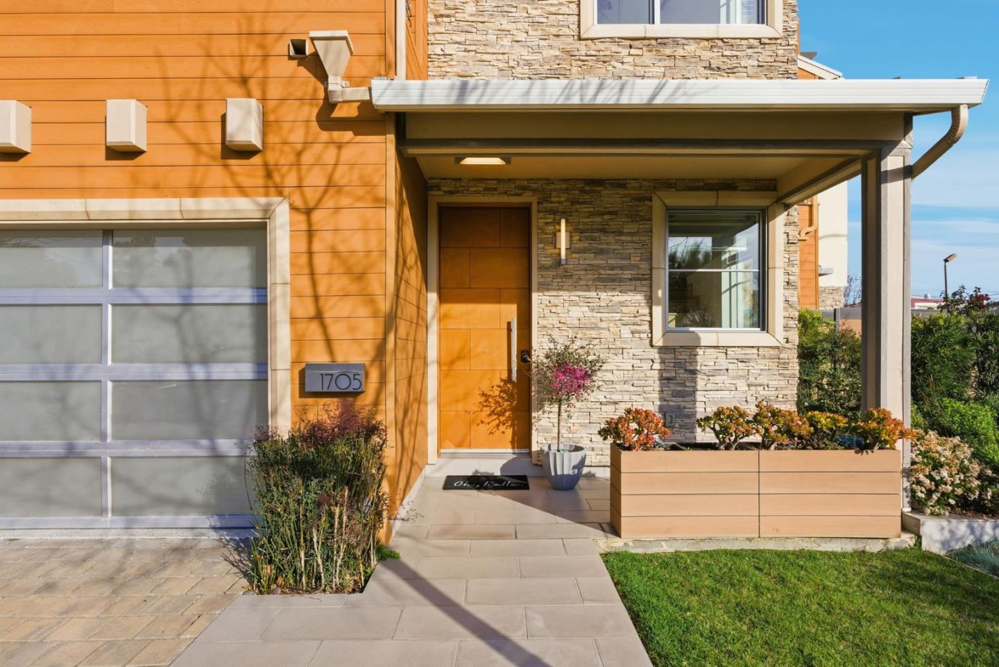 1705 Lawrence Road Santa Clara, CA 95051 - Photo 2 of 45 a front view of a house with a garden and plants