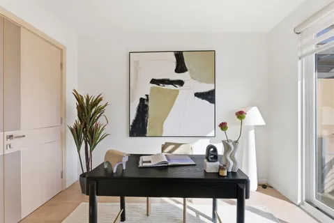 a table with a vase and flowers on it