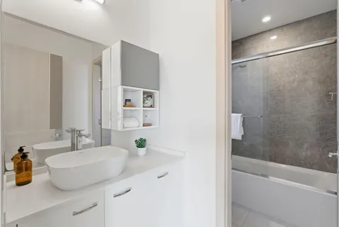 a bathroom with a sink and a mirror
