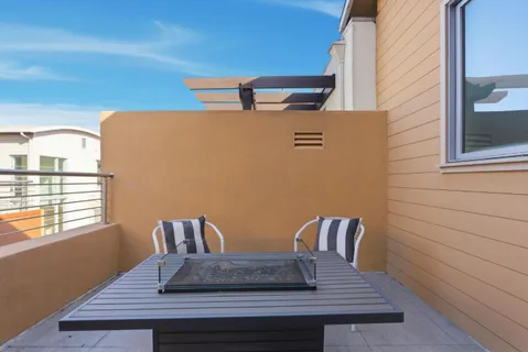 a view of table and chair in the room