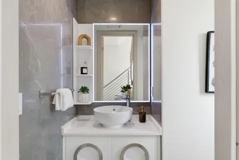 a bathroom with a sink and a mirror