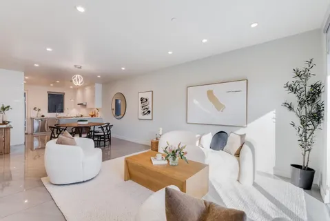 a living room with furniture and a table