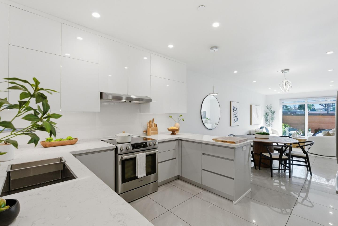 1705 Lawrence Road Santa Clara, CA 95051 - Photo 10 of 45 a kitchen with a sink white cabinets and stainless steel appliances