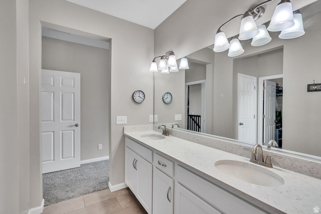 3269 West 650 North Layton, UT 84041 - Photo 16 of 35 Dual vanity featuring white cabinetry, light-toned countertops, and brushed nickel fixtures