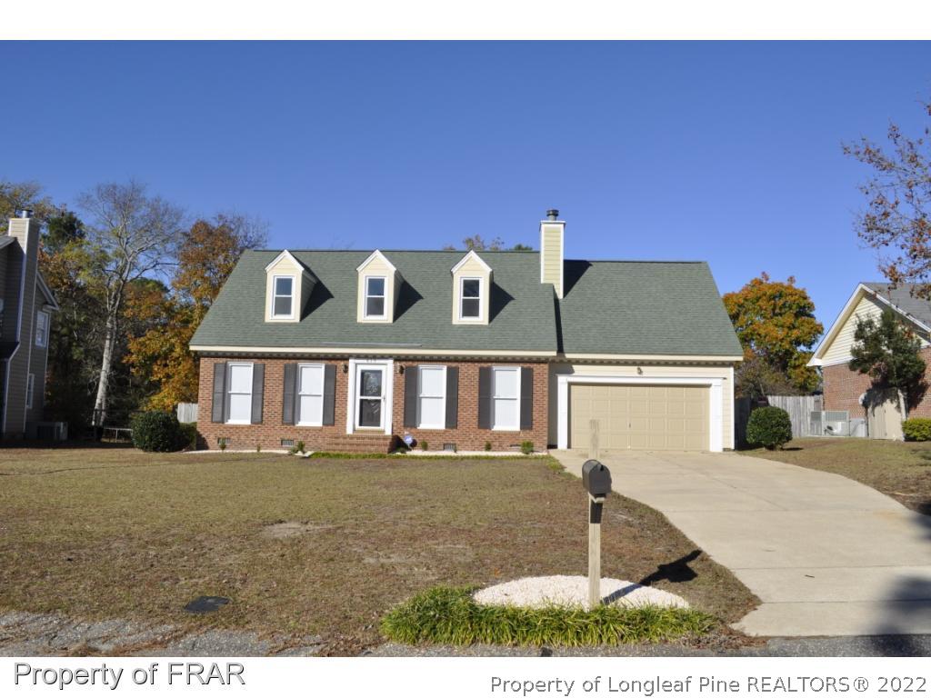 410 Saddle Ridge Road Fayetteville, NC 28311 - Photo 1 of 31 a view of a white house with a yard