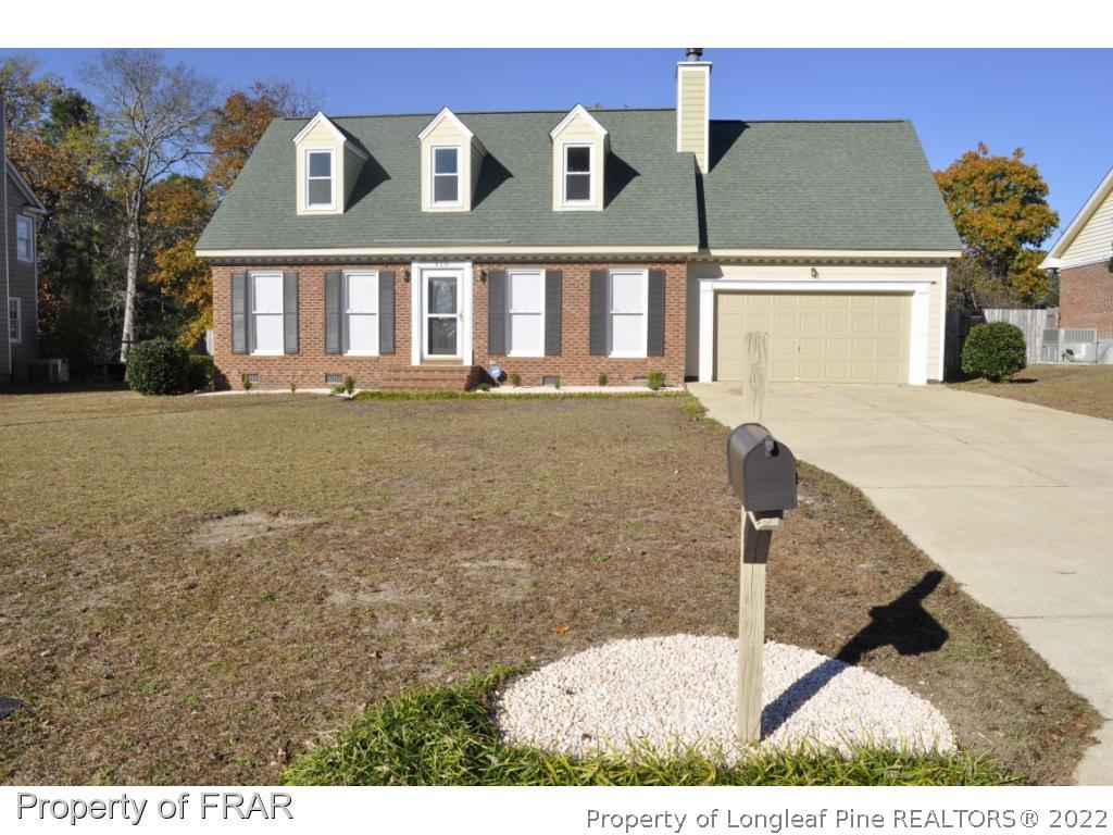 410 Saddle Ridge Road Fayetteville, NC 28311 - Photo 2 of 31 a view of a brick house with a yard