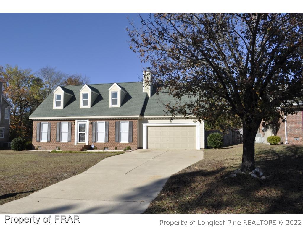 410 Saddle Ridge Road Fayetteville, NC 28311 - Photo 3 of 31 a front view of a house with a garden