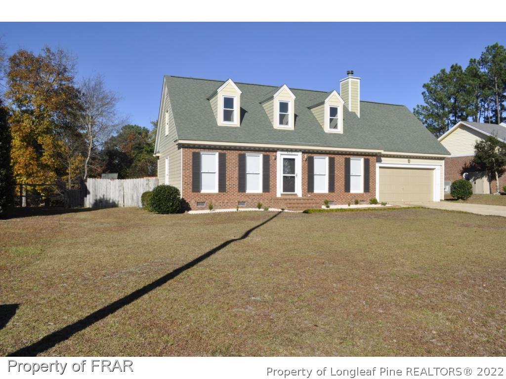 410 Saddle Ridge Road Fayetteville, NC 28311 - Photo 4 of 31 a front view of a house with a yard
