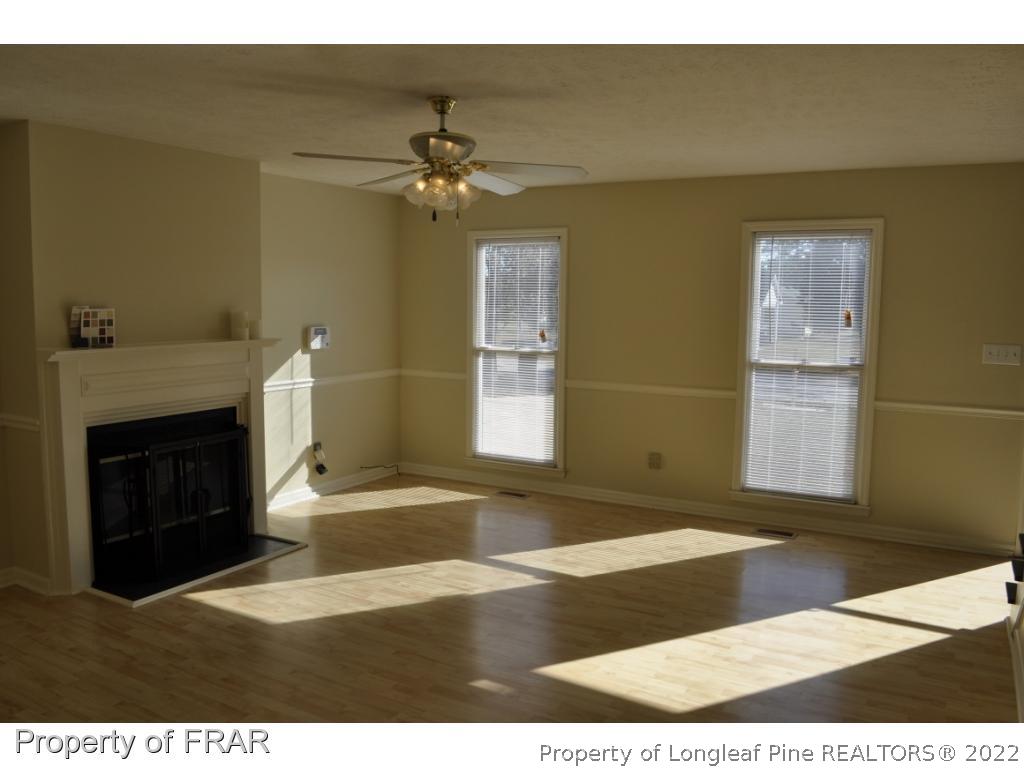 410 Saddle Ridge Road Fayetteville, NC 28311 - Photo 6 of 31 a view of an empty room with a fireplace