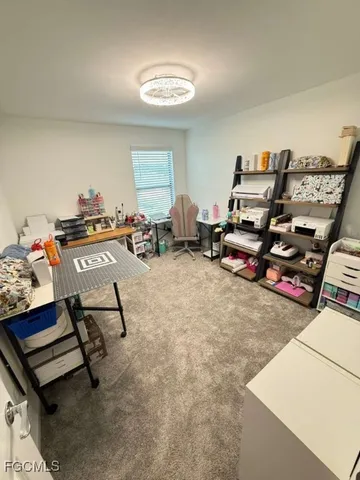 a living room with furniture a air conditioner vent and a window