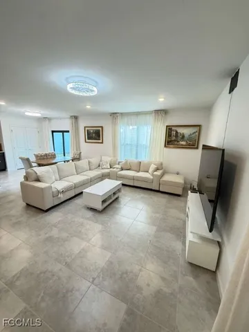 a living room with furniture and a couch