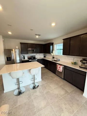 a large kitchen with lots of counter space and appliances