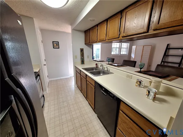 a kitchen with sink cabinets and window