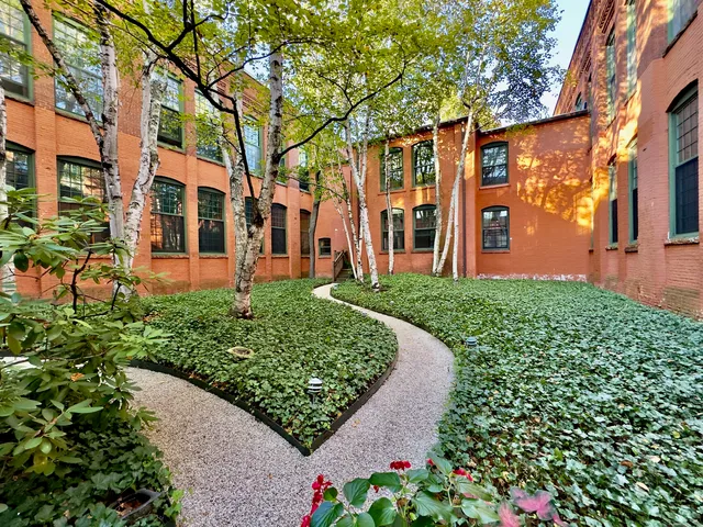 front view of a building with a yard