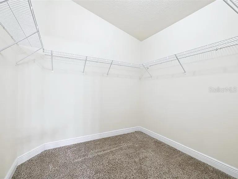 404 Rio Grande Court Poinciana, FL 34759 - Photo 14 of 21 a view of a room with racks on the wall