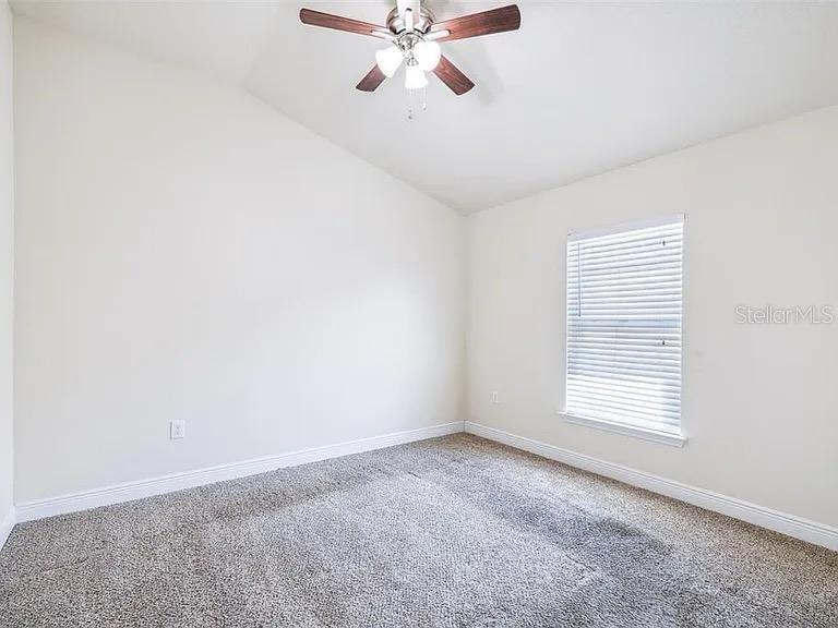 404 Rio Grande Court Poinciana, FL 34759 - Photo 15 of 21 a view of an empty room with a window