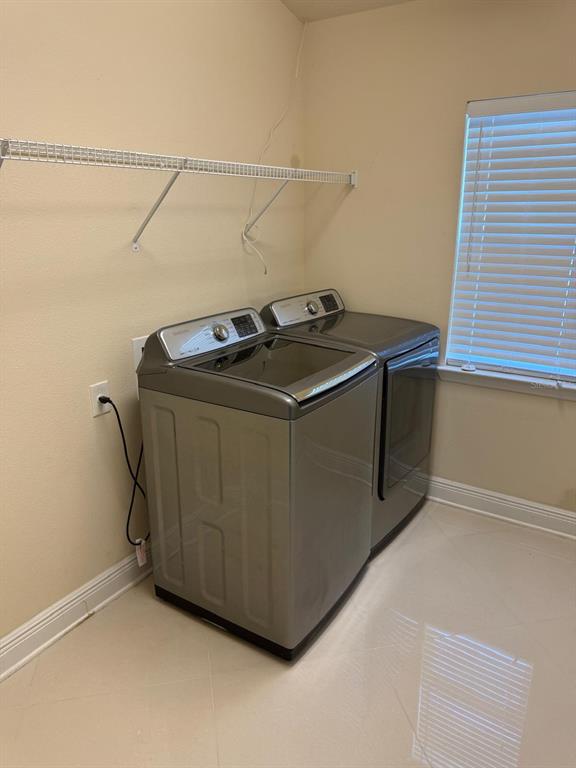 404 Rio Grande Court Poinciana, FL 34759 - Photo 19 of 21 a utility room with dryer and washer