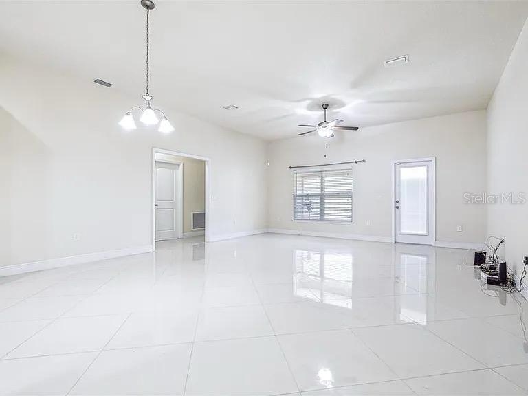 404 Rio Grande Court Poinciana, FL 34759 - Photo 3 of 21 a view of an empty room with a window