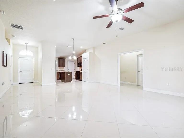 404 Rio Grande Court Poinciana, FL 34759 - Photo 5 of 21 a view of a kitchen with a sink and a refrigerator