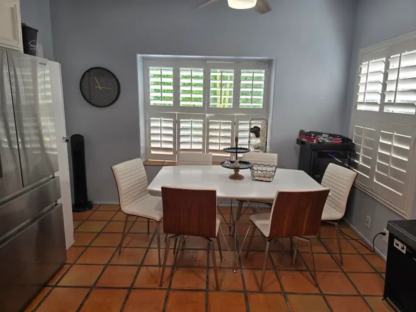 a view of a dining room with furniture and window