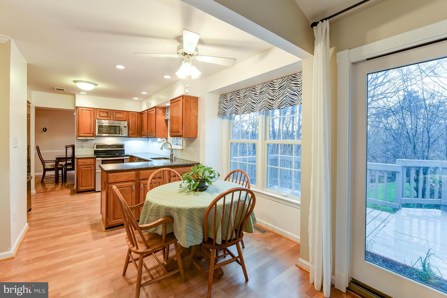 7434 Ridge Road Springfield, VA 22153 - Photo 8 of 30 a dining room with furniture and wooden floor