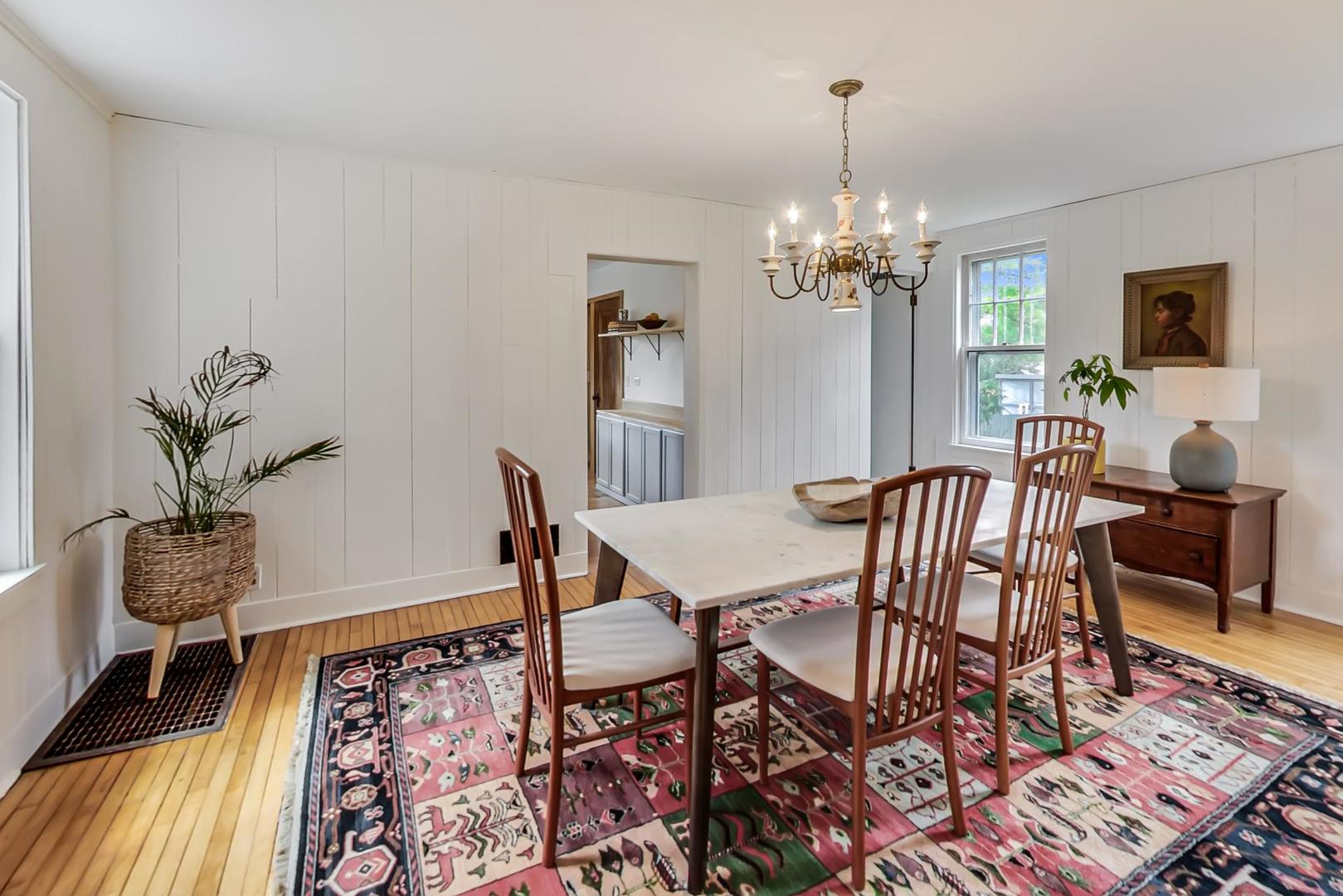20792 Illinois Rte 59 Barrington, IL 60010 - Photo 11 of 35 a view of a dining room with furniture wooden floor and chandelier