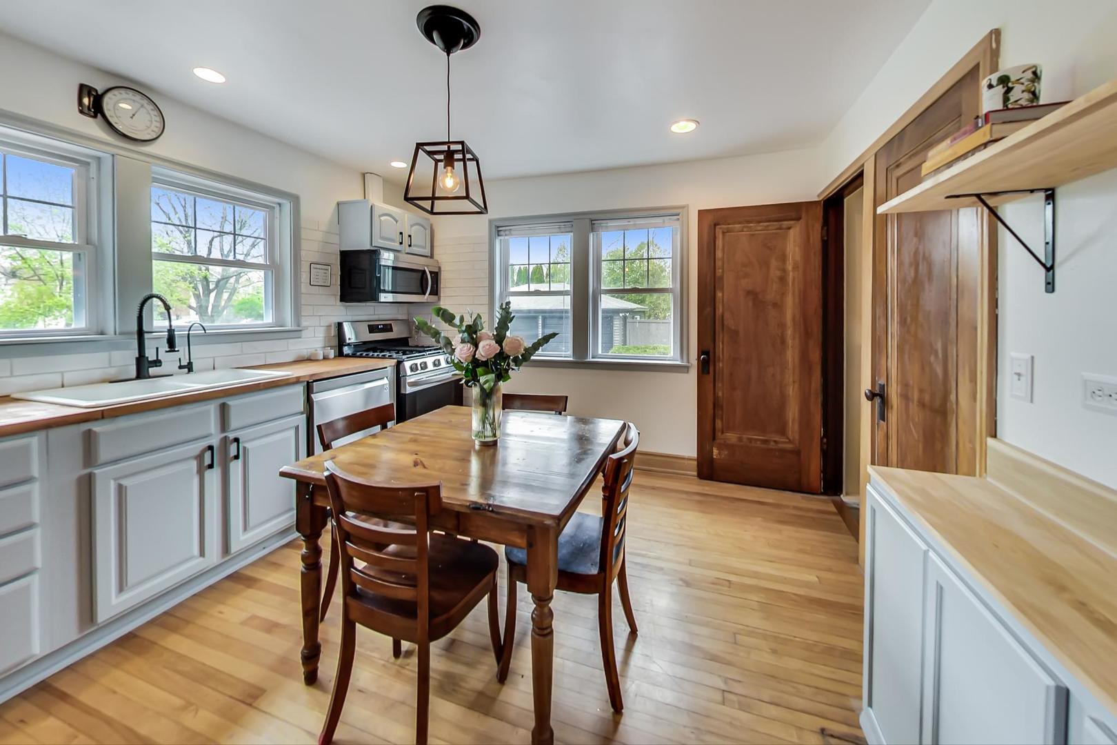 20792 Illinois Rte 59 Barrington, IL 60010 - Photo 15 of 35 a view of a dining room with furniture window and wooden floor