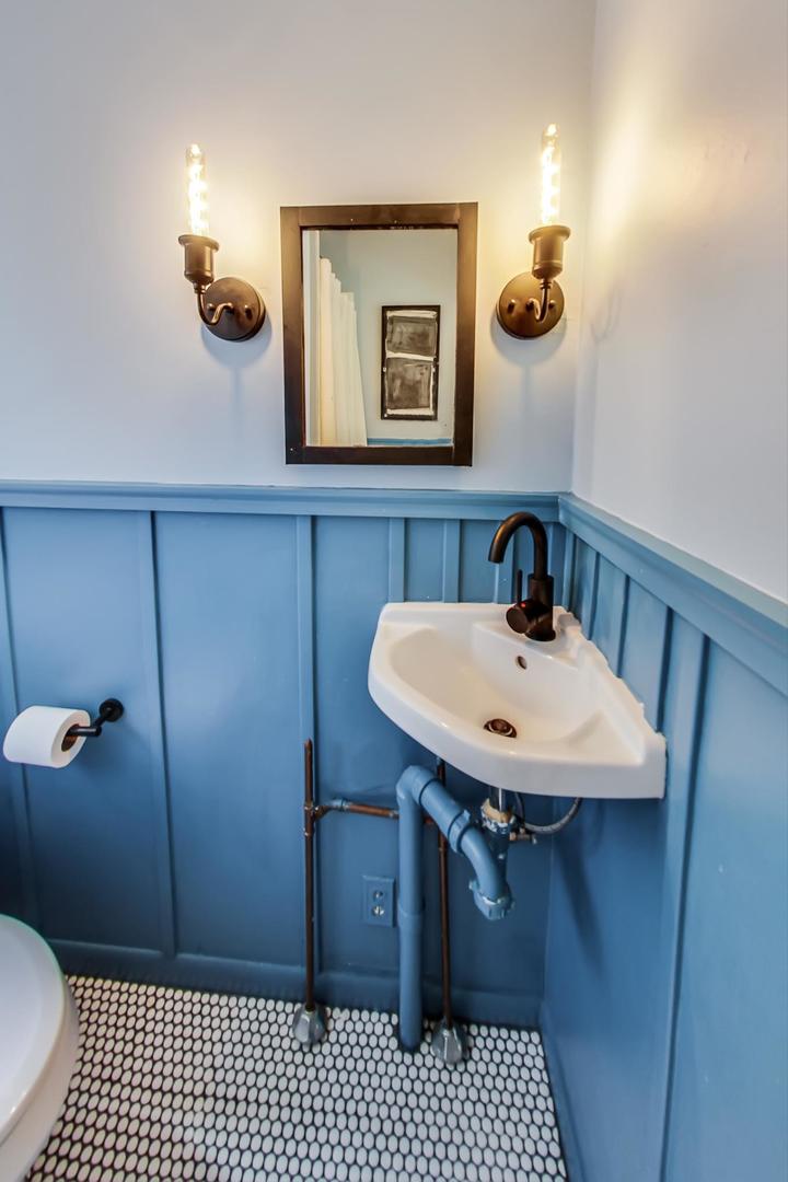 20792 Illinois Rte 59 Barrington, IL 60010 - Photo 17 of 35 a bathroom with a sink a toilet a mirror and shower