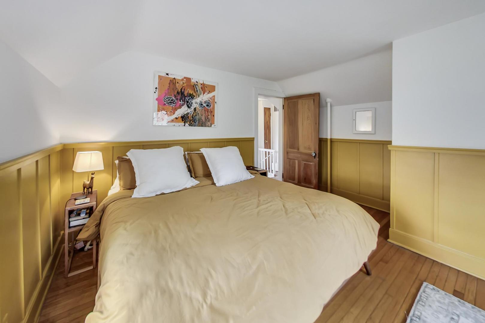 20792 Illinois Rte 59 Barrington, IL 60010 - Photo 20 of 35 a bed room with a bed and a painting on the wall