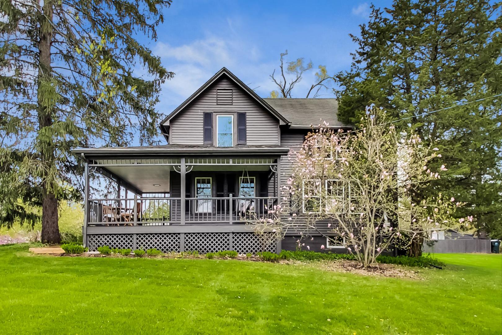 20792 Illinois Rte 59 Barrington, IL 60010 - Photo 2 of 35 a front view of a house with a garden