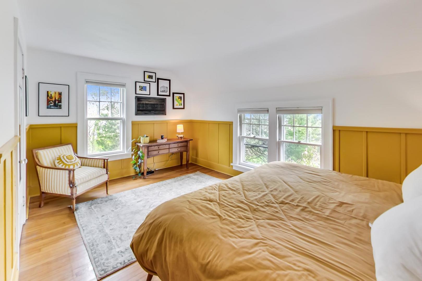 20792 Illinois Rte 59 Barrington, IL 60010 - Photo 22 of 35 a bedroom with a bed and wooden floor