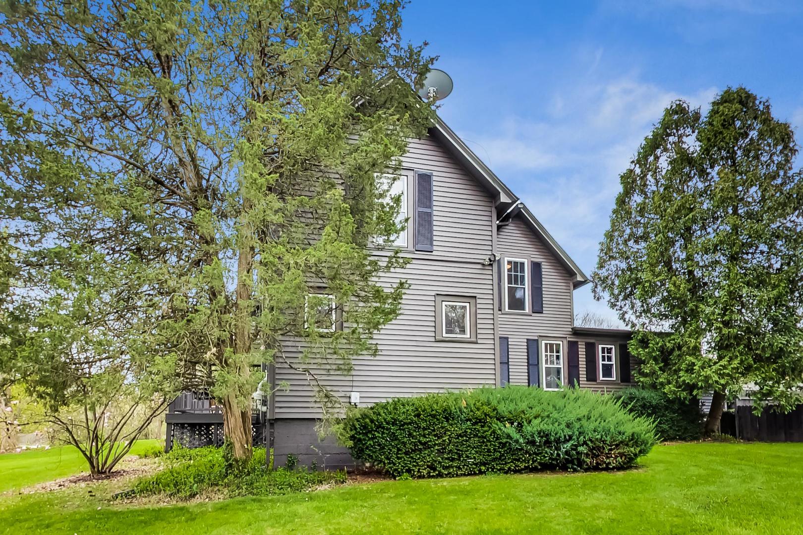 20792 Illinois Rte 59 Barrington, IL 60010 - Photo 3 of 35 a house that has a tree in front of the house