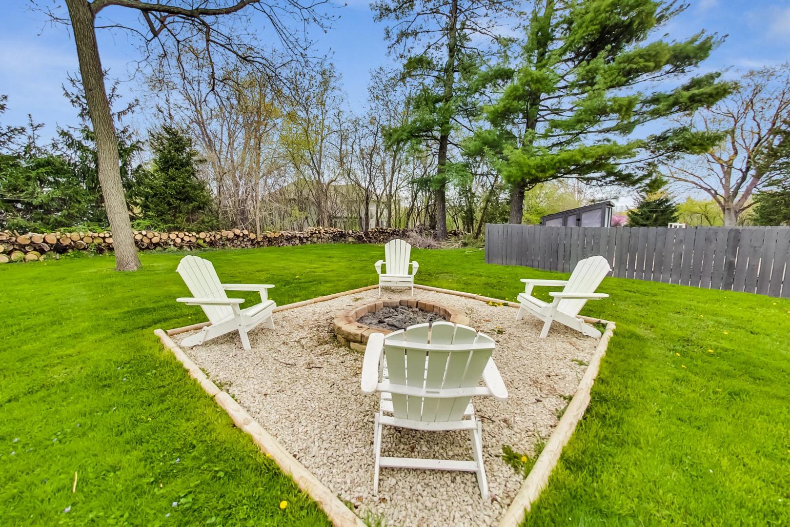 20792 Illinois Rte 59 Barrington, IL 60010 - Photo 33 of 35 a view of a backyard with sitting area